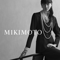 model wearing mikimoto pearl necklaces and bracelets