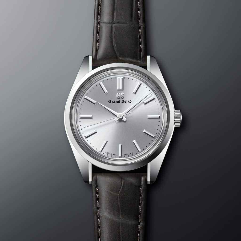 grand seiko watch with silver gray dial and black leather strap